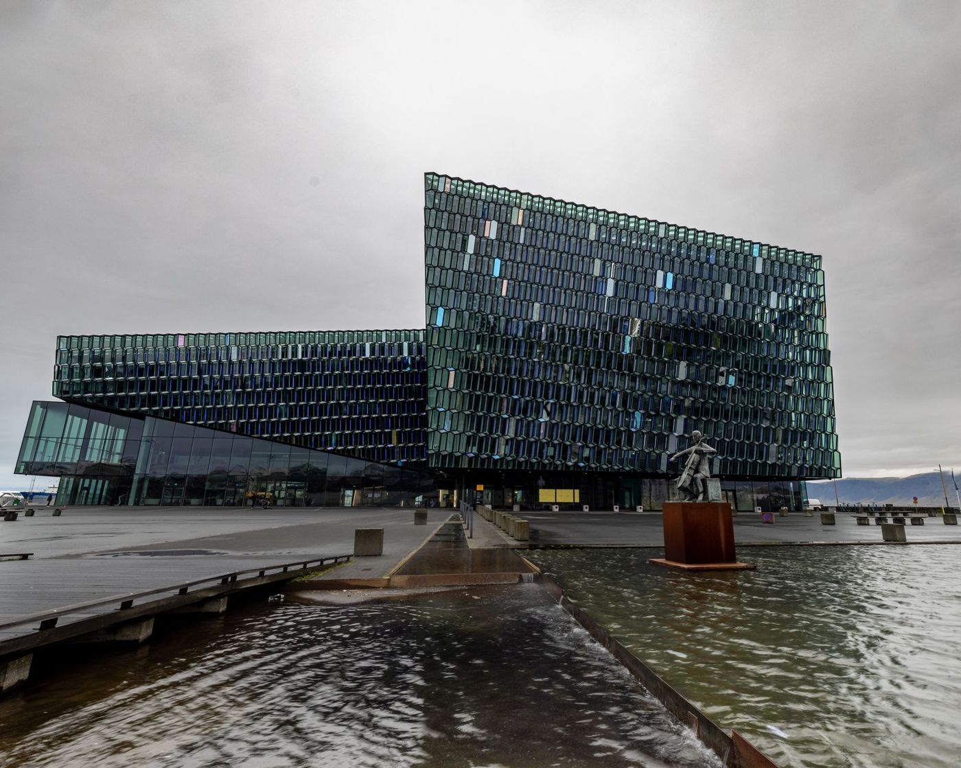 Harpa's glass facade catching evening light on the harbour